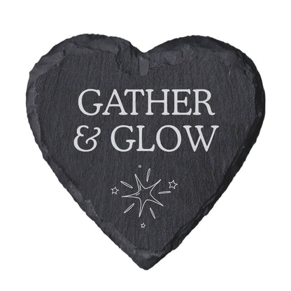 Heart-shaped slate coaster with 'Gather & Glow' text and star design on a white background