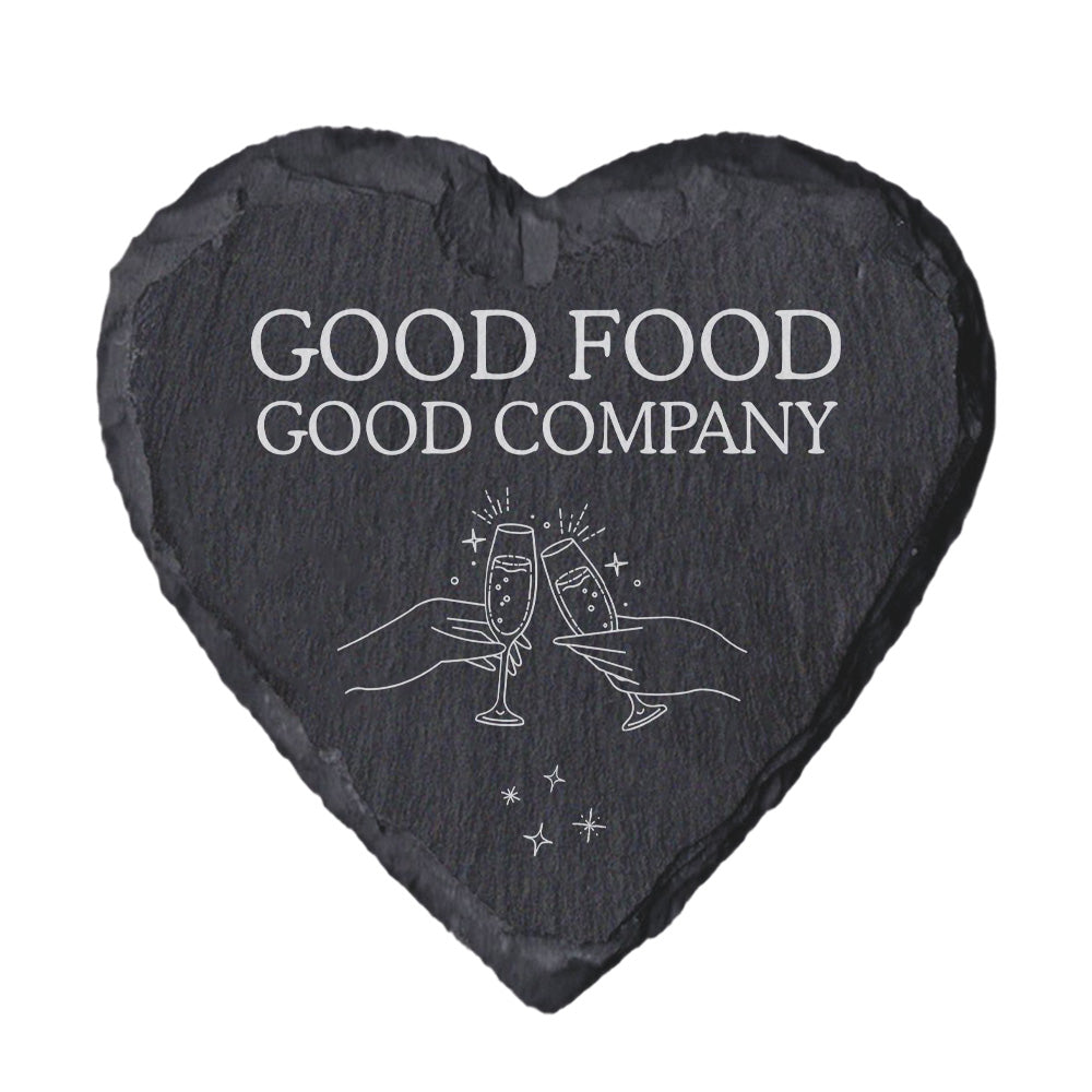 Heart-shaped slate coaster with 'Good Food Good Company' text and champagne glass design.