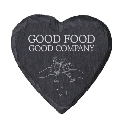Heart-shaped slate coaster with 'Good Food Good Company' text and champagne glass design.