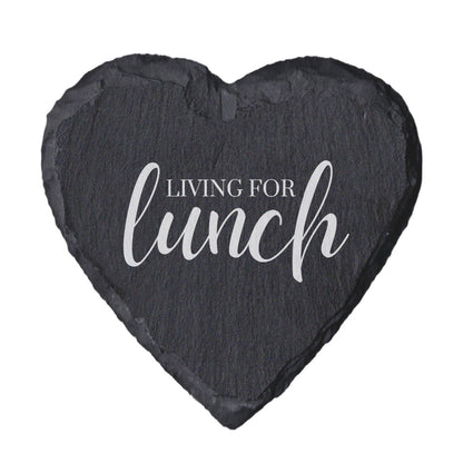 Heart-shaped slate coaster with 'Living for lunch' text on a white background