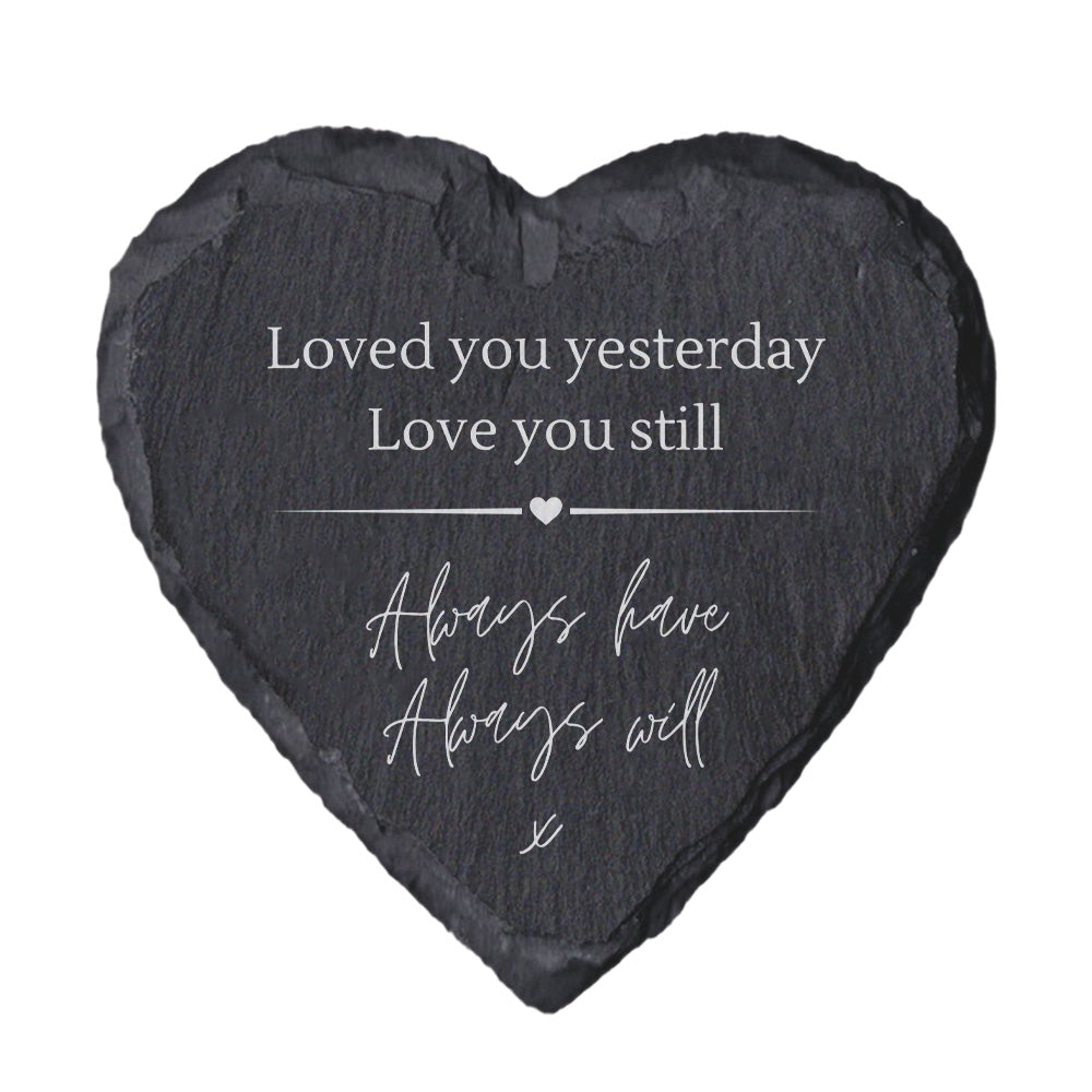 Heart-shaped slate with quote "loved you yesterday love you still always have always will" on a white background