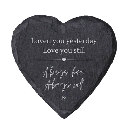 Heart-shaped slate with quote "loved you yesterday love you still always have always will" on a white background