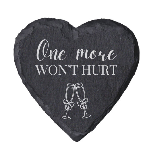 Heart-shaped slate coaster with 'One more won't hurt' text and champagne glass illustrations on a white background
