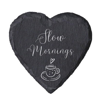 Heart-shaped slate coaster with 'Slow mornings' text on a white background