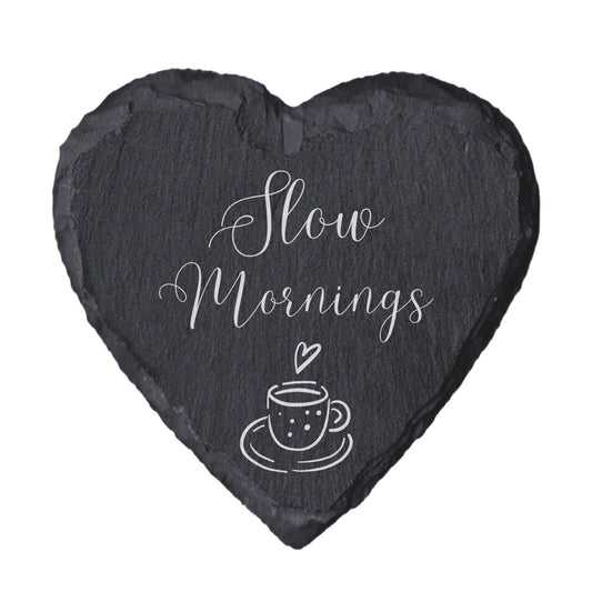 Heart-shaped slate coaster with 'Slow mornings' text on a white background