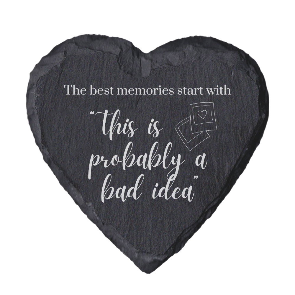 Heart-shaped slate coaster with quote "The best memori9es start with this is probably a bad idea" on a white background
