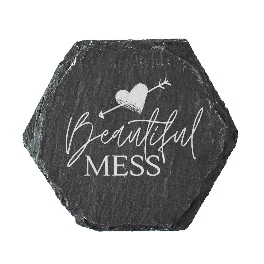 Hexagonal black slate slate coaster with 'Beautiful Mess' text and heart design on a white background