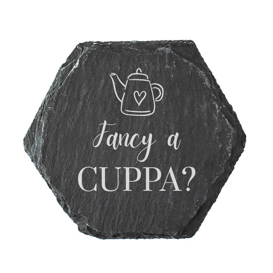 Hexagonal slate coaster with teapot illustration and text 'Fancy a CUPPA?' on a white background