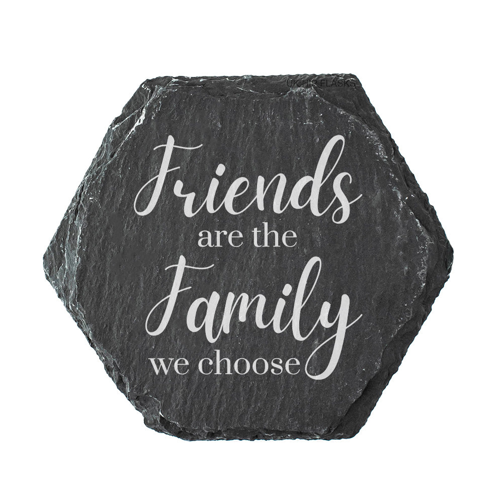Hexagonal slate coaster with white text 'Friends are the family we choose' on a white background