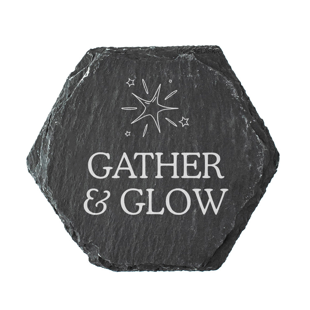 Hexagonal black slate coaster with 'Gather & Glow' quote on a white background