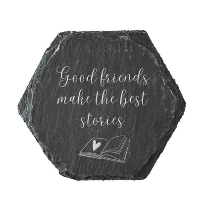 A hexagon slate coaster with the quote "good friends make the best stories" in white text.