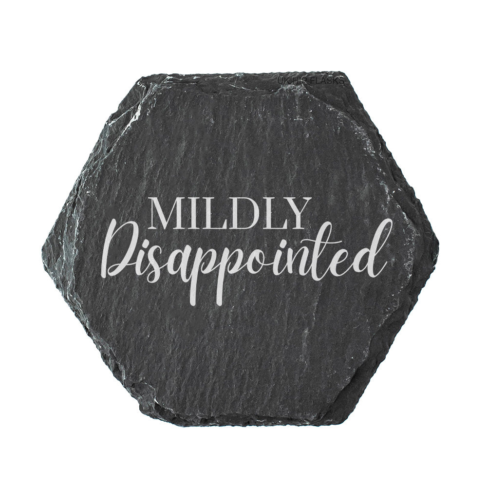 Hexagonal black slate coaster with 'Mildly Disappointed' text on a white background