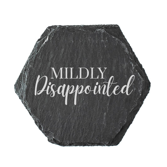 Hexagonal black slate coaster with 'Mildly Disappointed' text on a white background