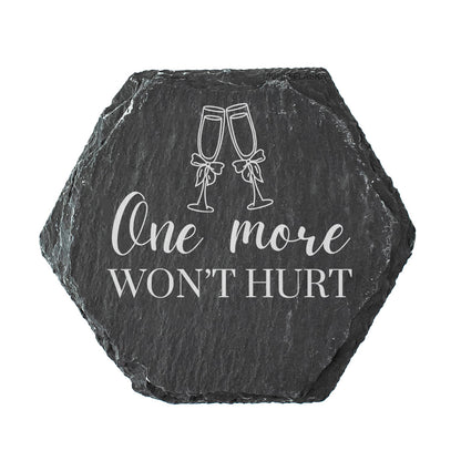 Hexagonal slate coaster with 'One more won't hurt' text and champagne glass design on a white background
