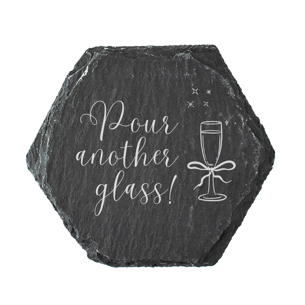 Hexagonal slate coaster with 'Pour another glass!' text and prosecco glass illustration on a white background