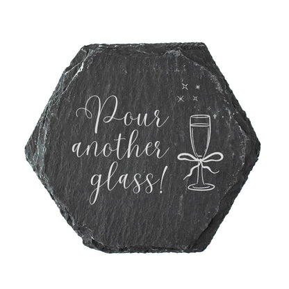 Hexagonal slate coaster with 'Pour another glass!' text and prosecco glass illustration on a white background