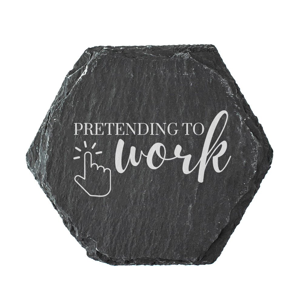Hexagonal black slate coaster with 'Pretending to work' text and cursor icon on a white background