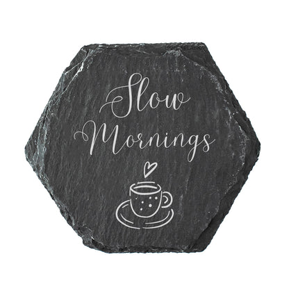 Hexagonal slate coaster with 'Slow Mornings' and a coffee cup design on a white background