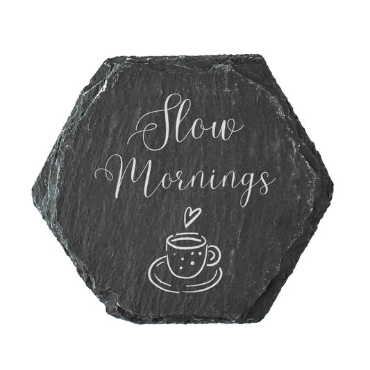 Hexagonal slate coaster with 'Slow Mornings' and a coffee cup design on a white background