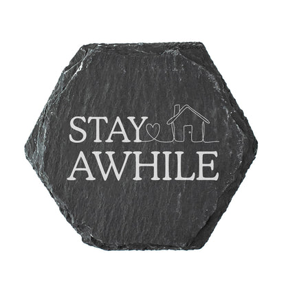 Hexagonal slate coaster with 'Stay Awhile' in white text.