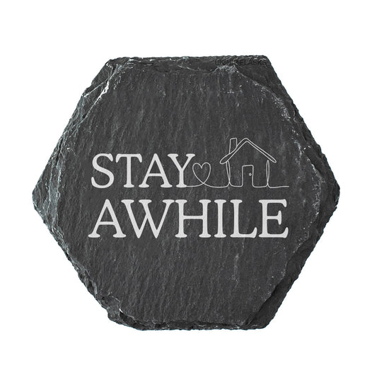 Hexagonal slate coaster with 'Stay Awhile' in white text.