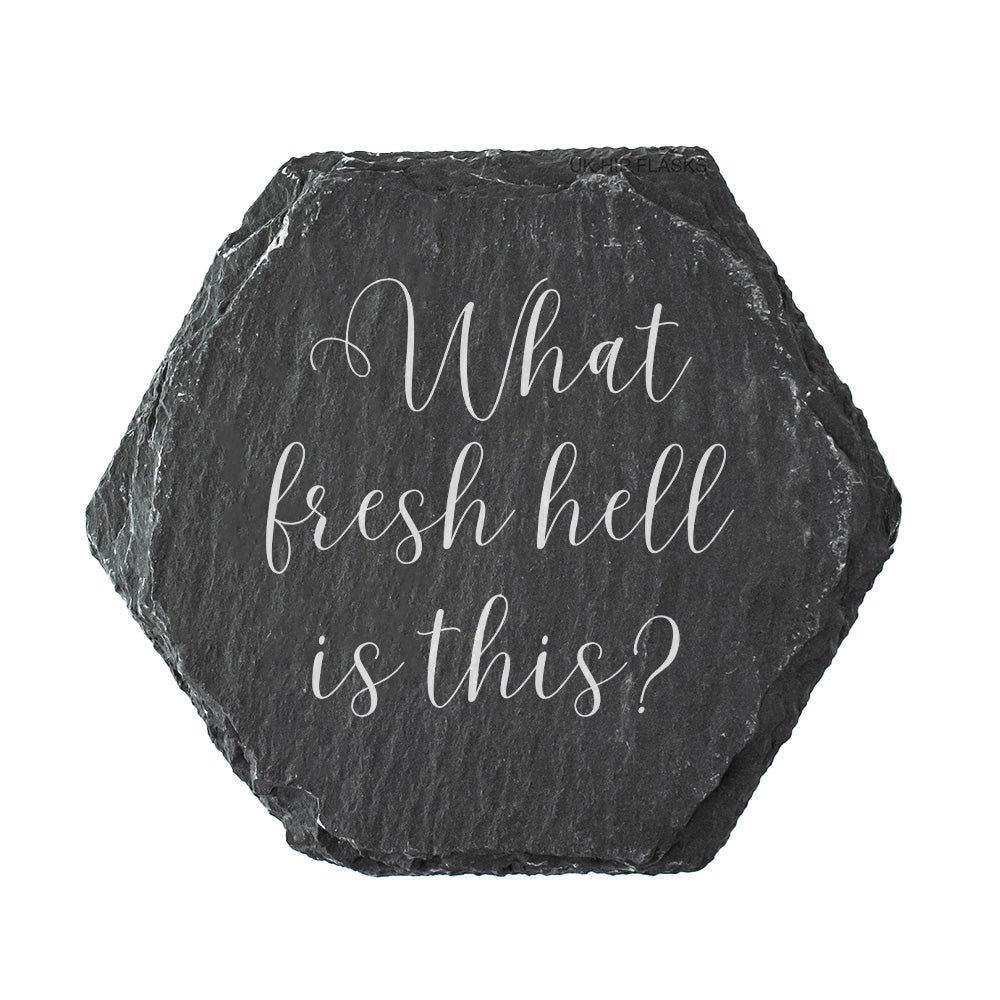 Hexagonal black slate coaster with white text 'What fresh hell is this?' on a white background
