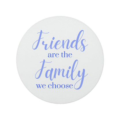 Round ceramic coaster featuring the thoughtful quote "Friends are the family we choose" in crisp lilac lettering.