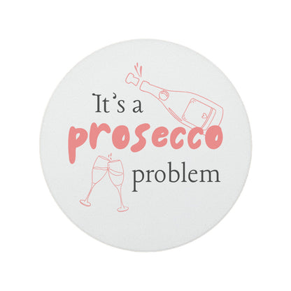 Round ceramic coaster featuring the humorous quote "It's a prosecco problem" in crisp pink lettering. 