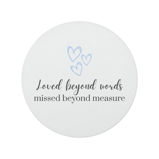 Round ceramic memorial coaster featuring the thoughtful words "Loved beyond words, missed beyond measure". 