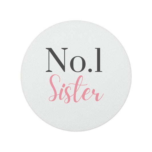 Round ceramic coaster features "No. 1 Sister" in dark grey and pink text.