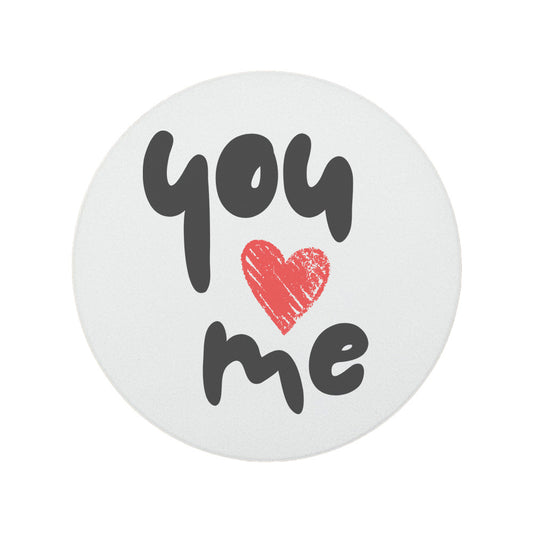 Round ceramic coaster featuring the quote "You 'heart' Me" in grey and red lettering. 