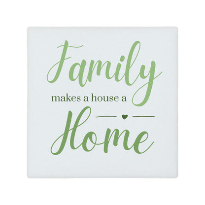 Square ceramic coaster featuring the meaningful quote "Family makes a house a home" in elegant green lettering. 
