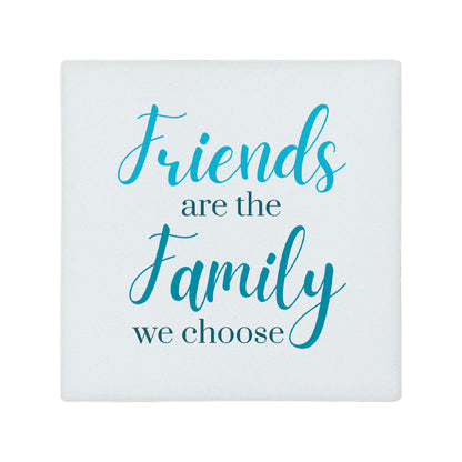 Square ceramic coaster featuring the thoughtful quote "Friends are the family we choose" in crisp turquoise lettering. 
