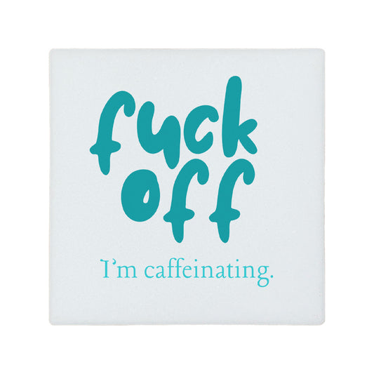 Square ceramic coaster with 'fuck off I'm caffeinating' in turquoise text.