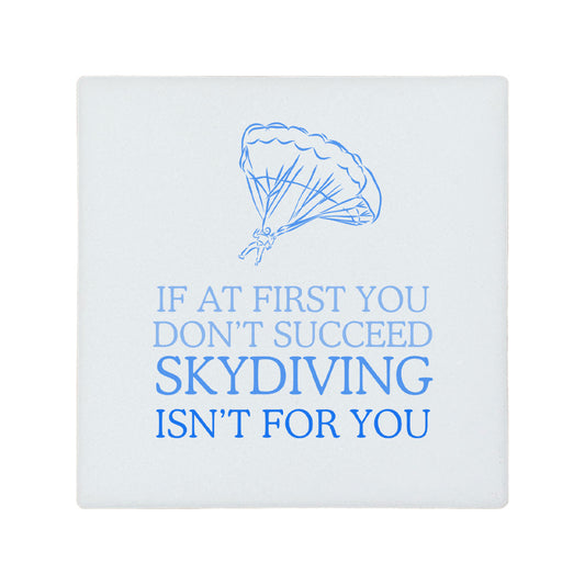 Square ceramic coaster featuring the funny quote "If at first you don't succeed, skydiving isn't for you" in crisp blue lettering with a parachute illustration.