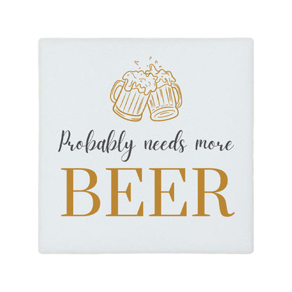 Square ceramic coaster featuring the funny quote "Probably needs more beer" in crisp grey and gold lettering with a beer glasses illustration. 