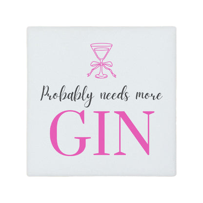 Square ceramic coaster featuring the funny quote "Probably needs more gin" in crisp grey and pink lettering with a gin glass illustration.