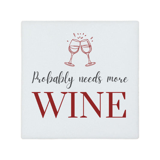 Square ceramic coaster featuring the funny quote "Probably needs more wine" in crisp grey and burgundy lettering with a wine glass illustration. 