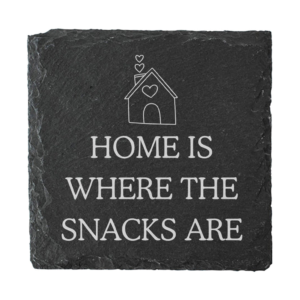 Slate coaster with 'Home is where the snacks are' text and house illustration.