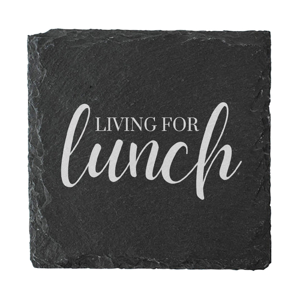 Slate coaster with 'Living for lunch' text on a white background