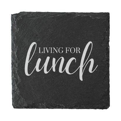 Slate coaster with 'Living for lunch' text on a white background