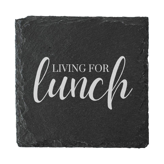 Slate coaster with 'Living for lunch' text on a white background