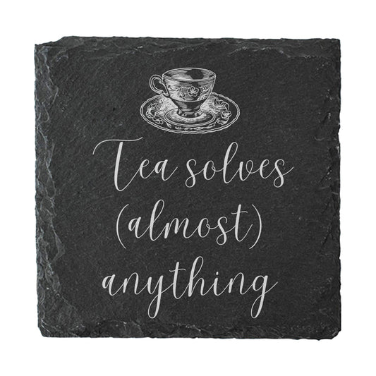Slate coaster with tea cup illustration and 'Tea solves (almost) anything' text