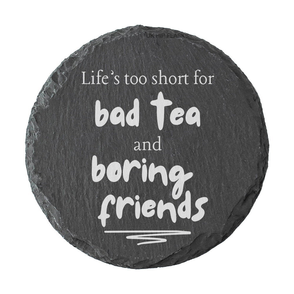 Round slate coaster with humorous quote on a white background