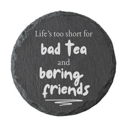 Round slate coaster with humorous quote on a white background
