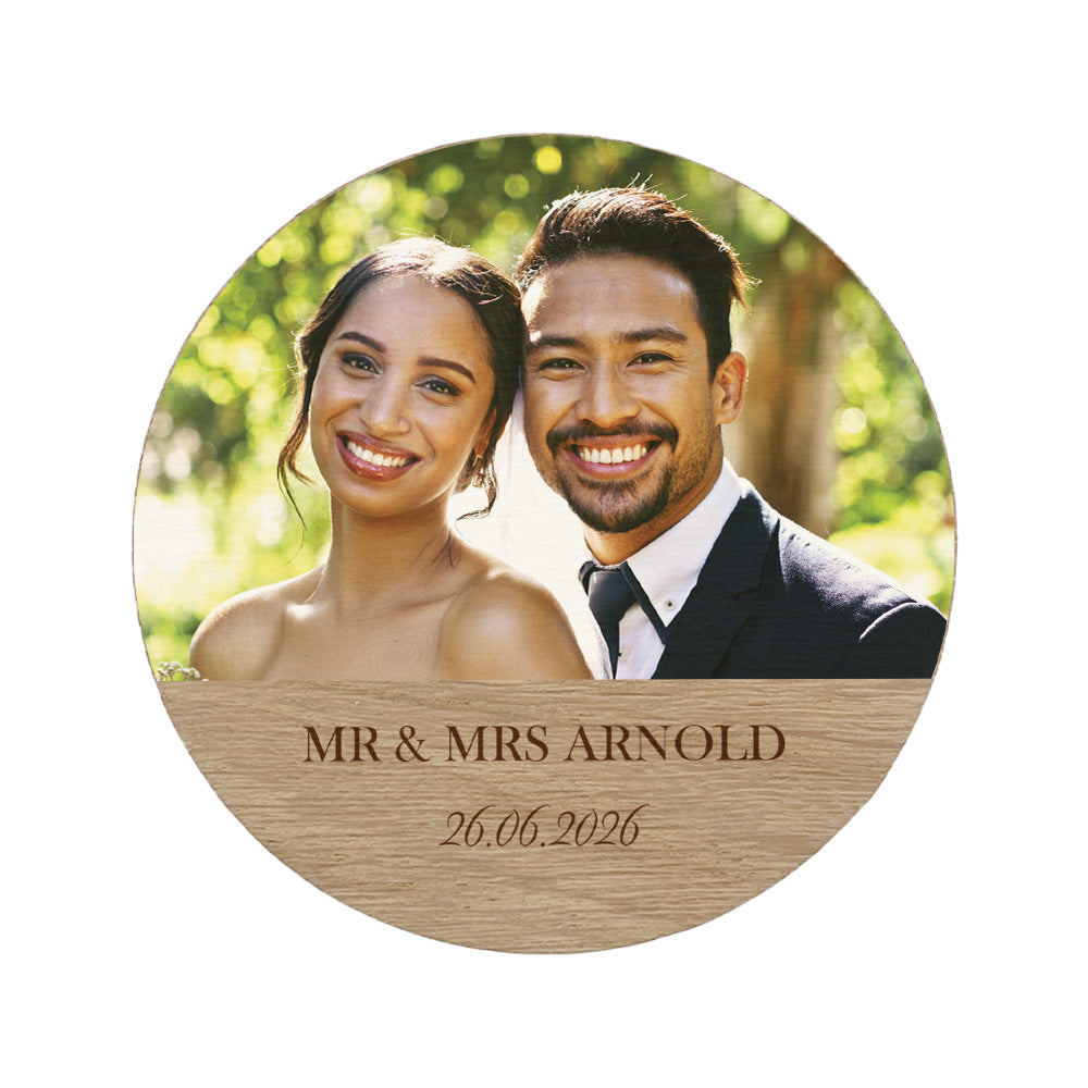 Round wooden plaque with a photo of a couple on their wedding day and personalised text and date