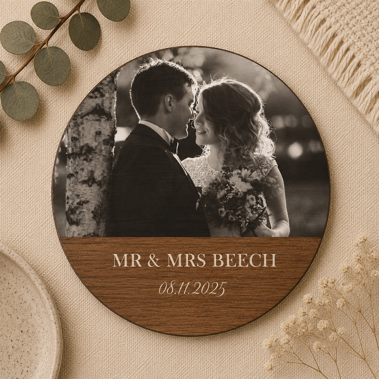 Round photo wooden coaster with a wedding photo and 'MR & MRS' name text on a decorative background.