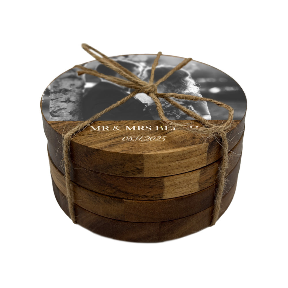 Set of wooden coasters personalised with a wedding photo, couple's name and date.