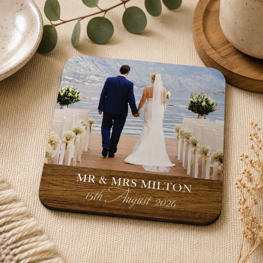 Personalised wedding photo coaster with custom name and date text on a pretty surface.